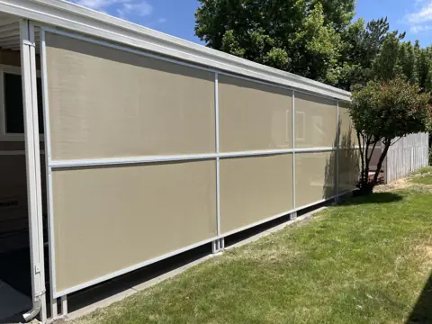 After: sun shade screen wall installed along a carport awning