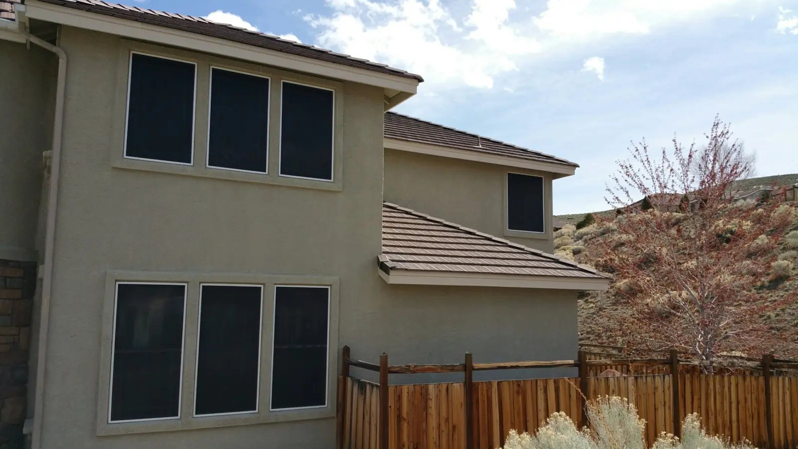 Two-story Reno-Sparks home with dark solar screens on every window