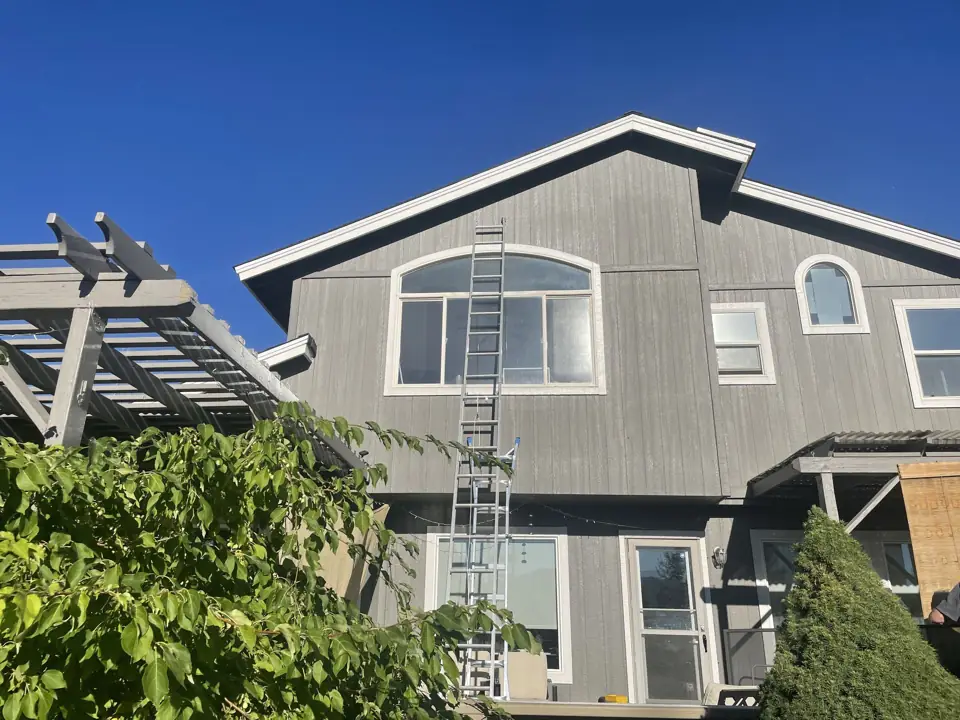 Before: upper-story and arched windows without solar screens